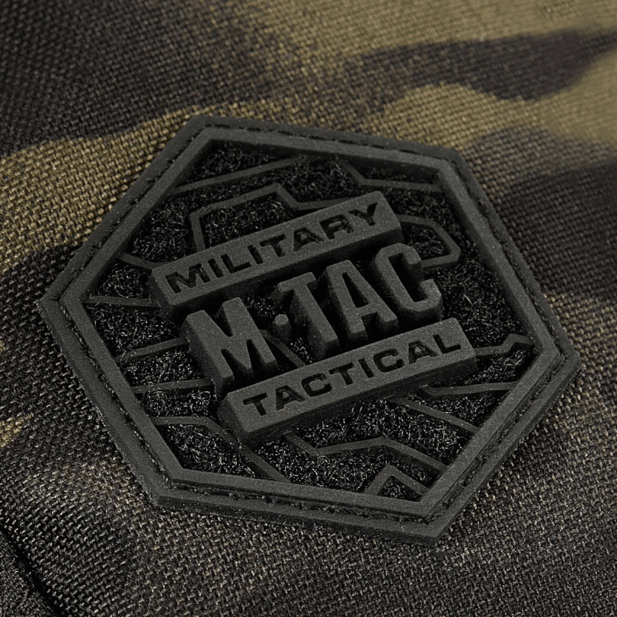 Detalje af M-Tac Sling Pistoltaske Elite Hex logo på slidstærkt Cordura 1000D materiale.