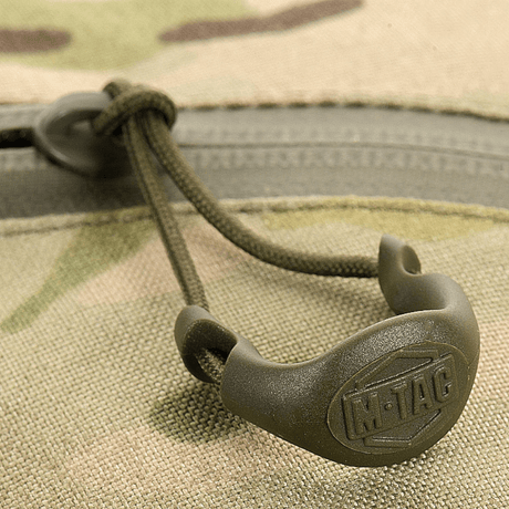Nærbillede af M-Tac Sling Pistoltaske Elite Hex lynlås, der viser holdbar Cordura 1000D materiale.