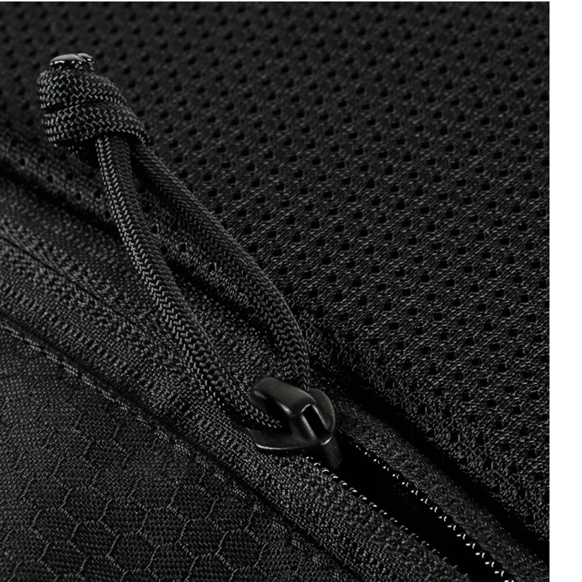 Nærbillede af lynlås og materiale på M-Tac Konvert Taske Elite, lavet af Cordura for slidstyrke og komfort.