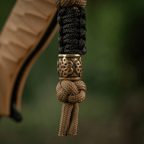 M-Tac Lanyard Scandinavian Small Chinese Knot med dekorativ perle. Stilfuldt tilbehør af snoet paracord, ideel til knive og lommelygter.
