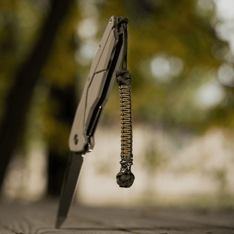 M-Tac Knife Lanyard Ninja i flettet paracord med unik stil, hurtig adgang til kniv, længde 14,5 cm, perfekt til udendørs brug.