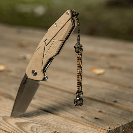 M-Tac Knife Lanyard Ninja i paracord med cupronickel perle, praktisk tilbehør til pocket knife, viser stil og funktionalitet.