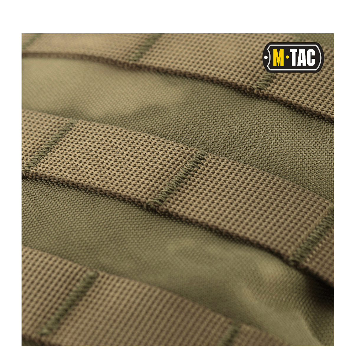 Nærbillede af M-Tac Assault Pack med MOLLE-fastgørelsessystem og solidt materiale til bybrug eller korte vandreture.