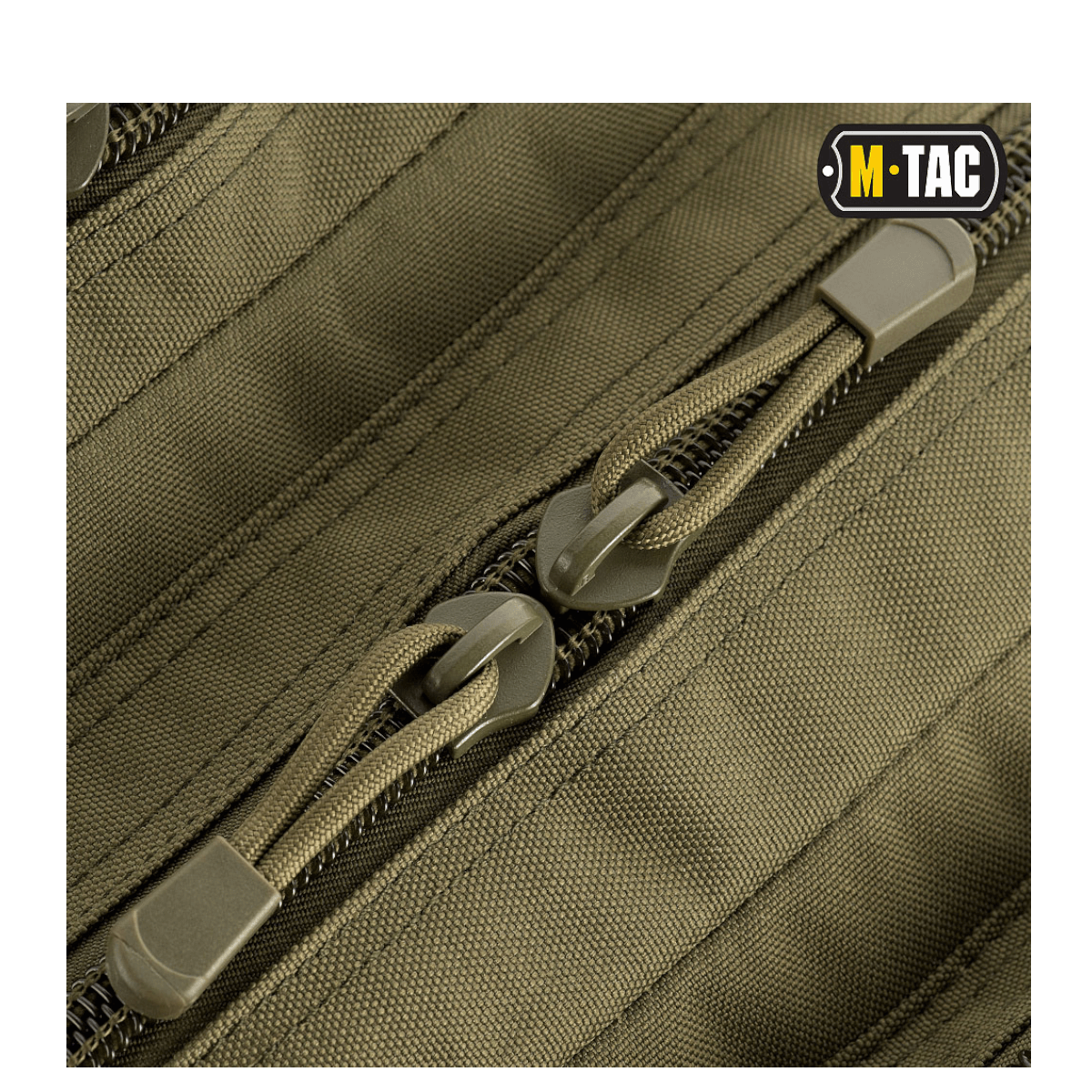 Nærbillede af lynlås og stof på M-Tac Large Assault Pack Rygsæk med MOLLE-system i khaki farve.