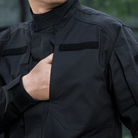 M-Tac Jakke Patrol Flex med ståkrave og velcro-paneler til ID og patches, ideel til taktisk brug med let figursyet snit.