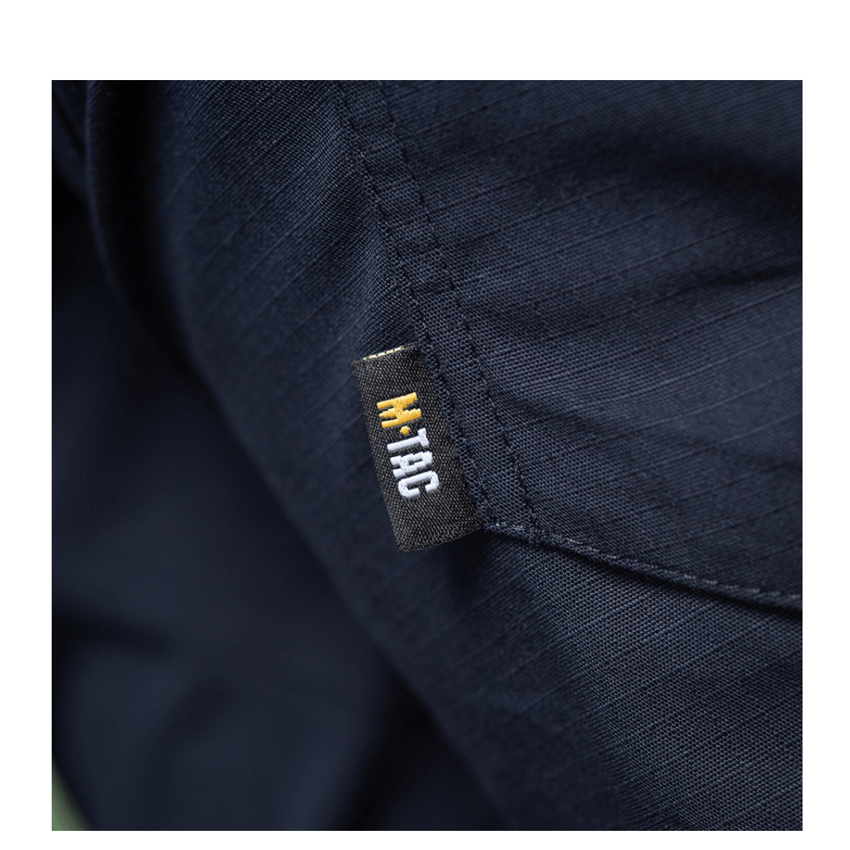 M-Tac Bukser Aggressor Dame Flex detaljeret syning i glat, vandafvisende materiale med M-Tac logo etikette.