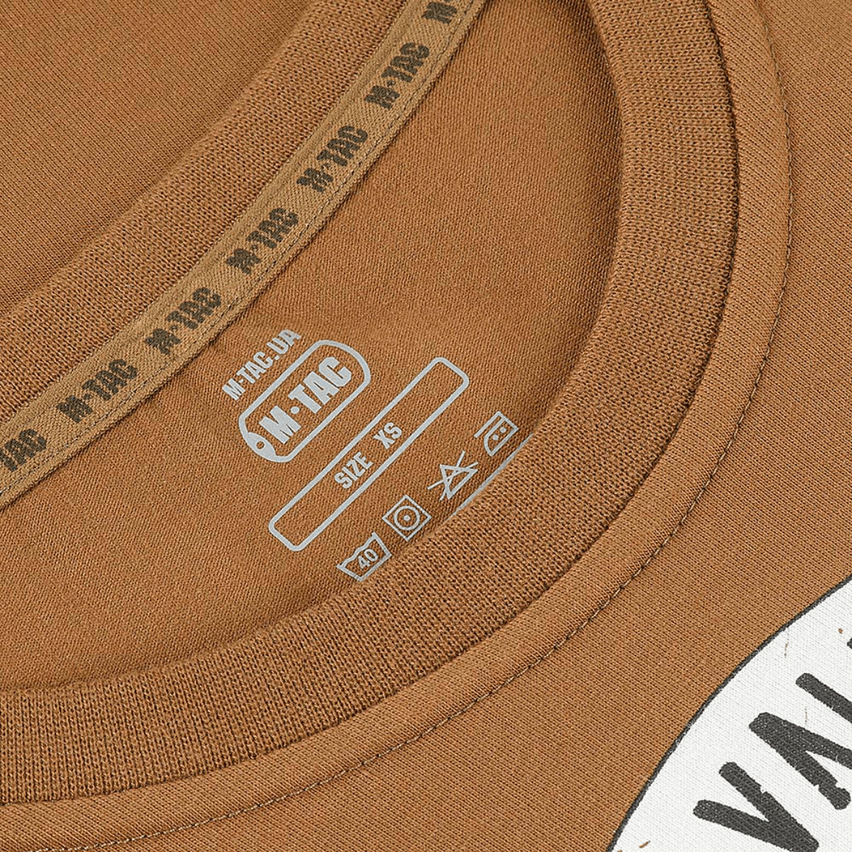 M-Tac T-shirt Viking close-up of neckline with size label and care instructions, highlighting quality and design.