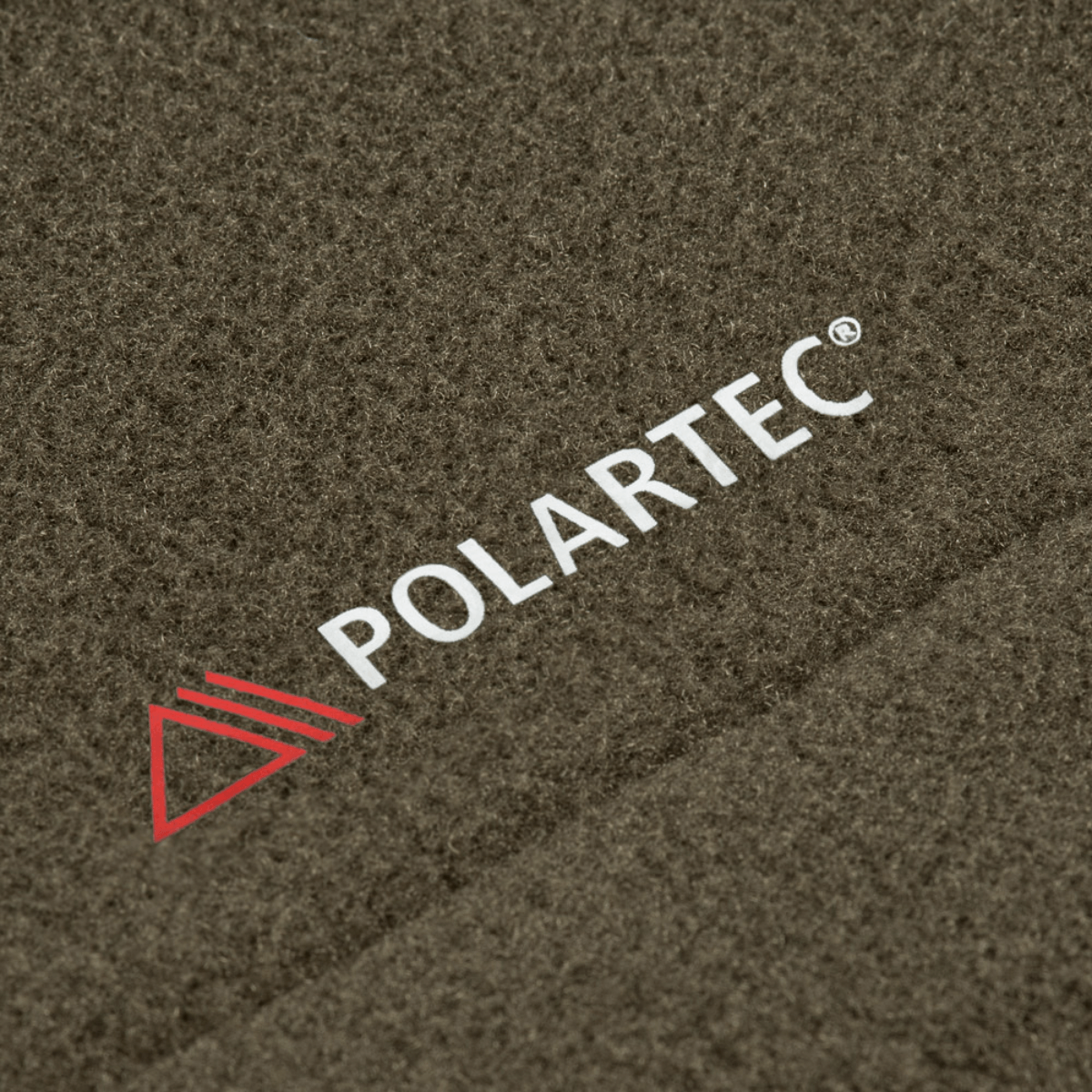 Detalje af Polartec® materiale fra M-Tac Sweater Nord Fleece Polartec Dame, der viser blød og holdbar tekstur.