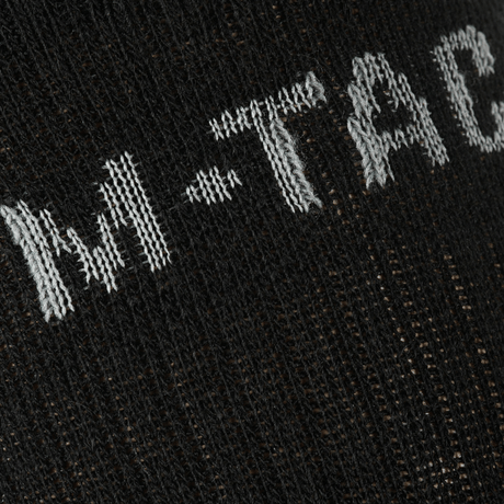 Nærbillede af M-Tac Sokker Winter Wool detaljeret strikmønster med merinould for varme og komfort i vintersæsonen.