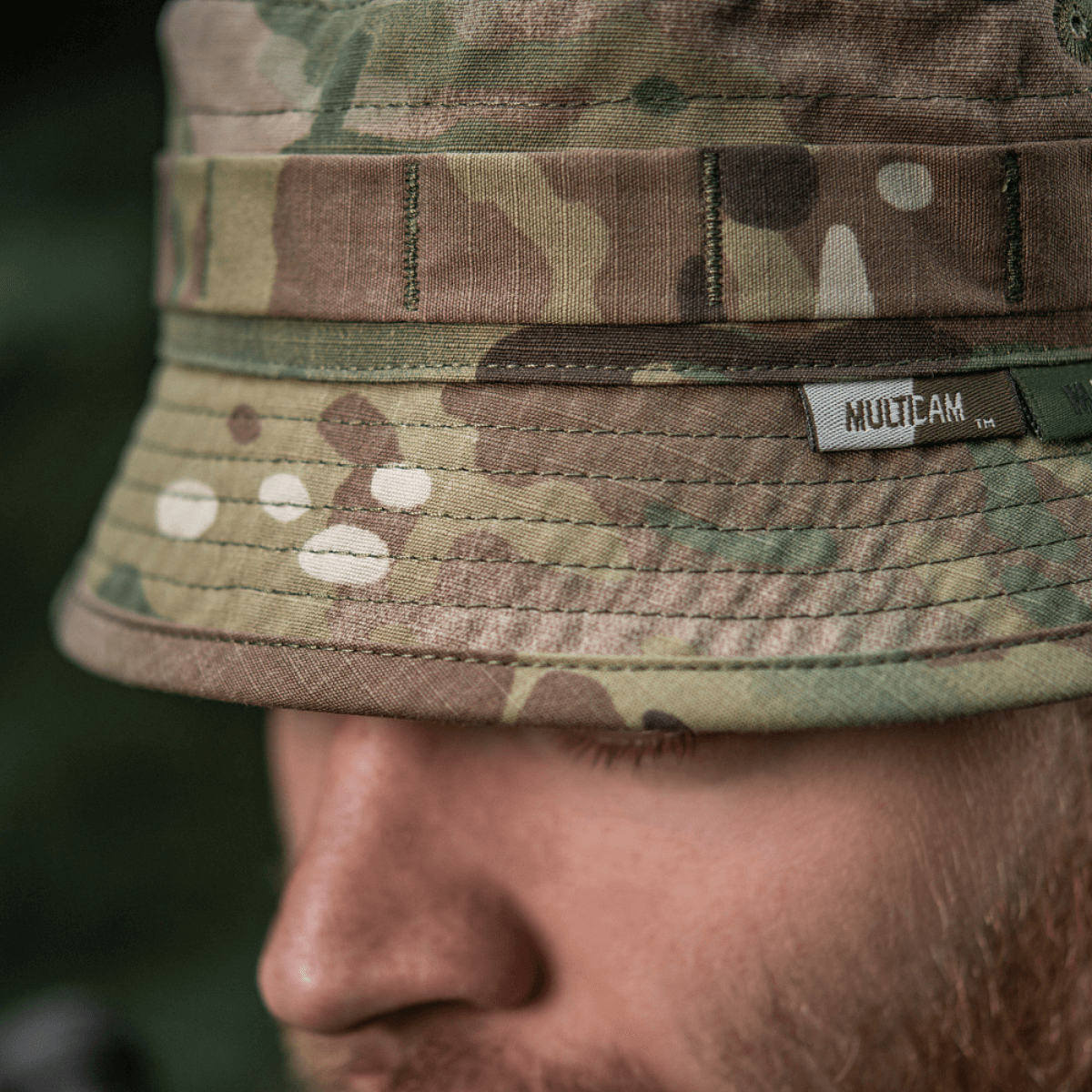 M-Tac Panama Hat Gen.II NYCO close-up, camo pattern, showcasing durable NYCO fabric and MOLLE interface, worn by person outdoors.