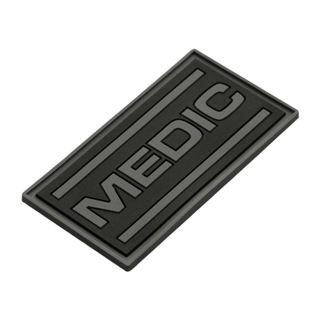 M-Tac Patch Medic PVC 3D taktik patch med velcro, med sort design og 3D-effekt. Dimensioner: 70 x 35 mm. Perfekt til uniformer og tasker.