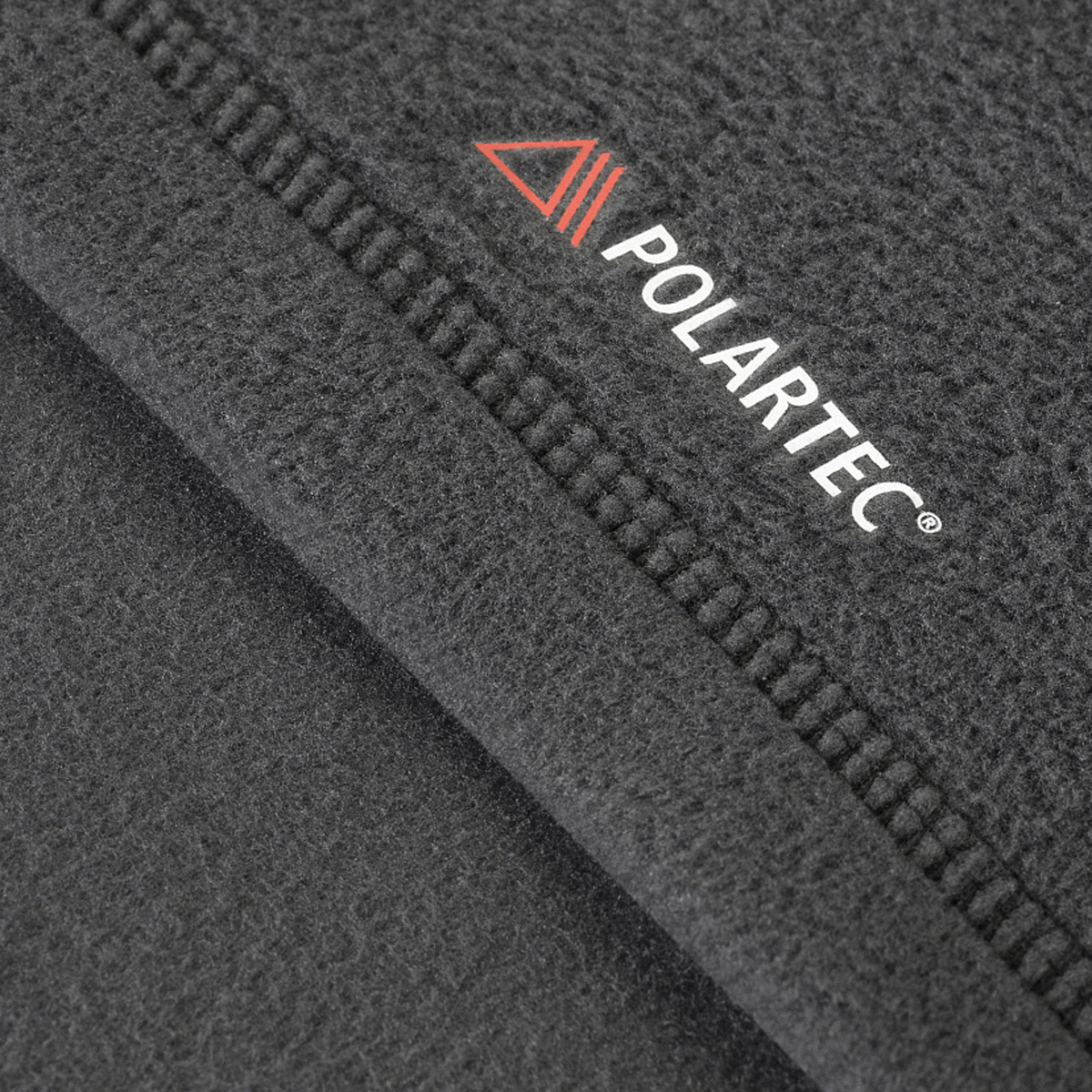 Nærbillede af M-Tac Delta Polartec Fleecejakke med Polartec® Micro Series-fleece stof, viser teksturen og kvaliteten.