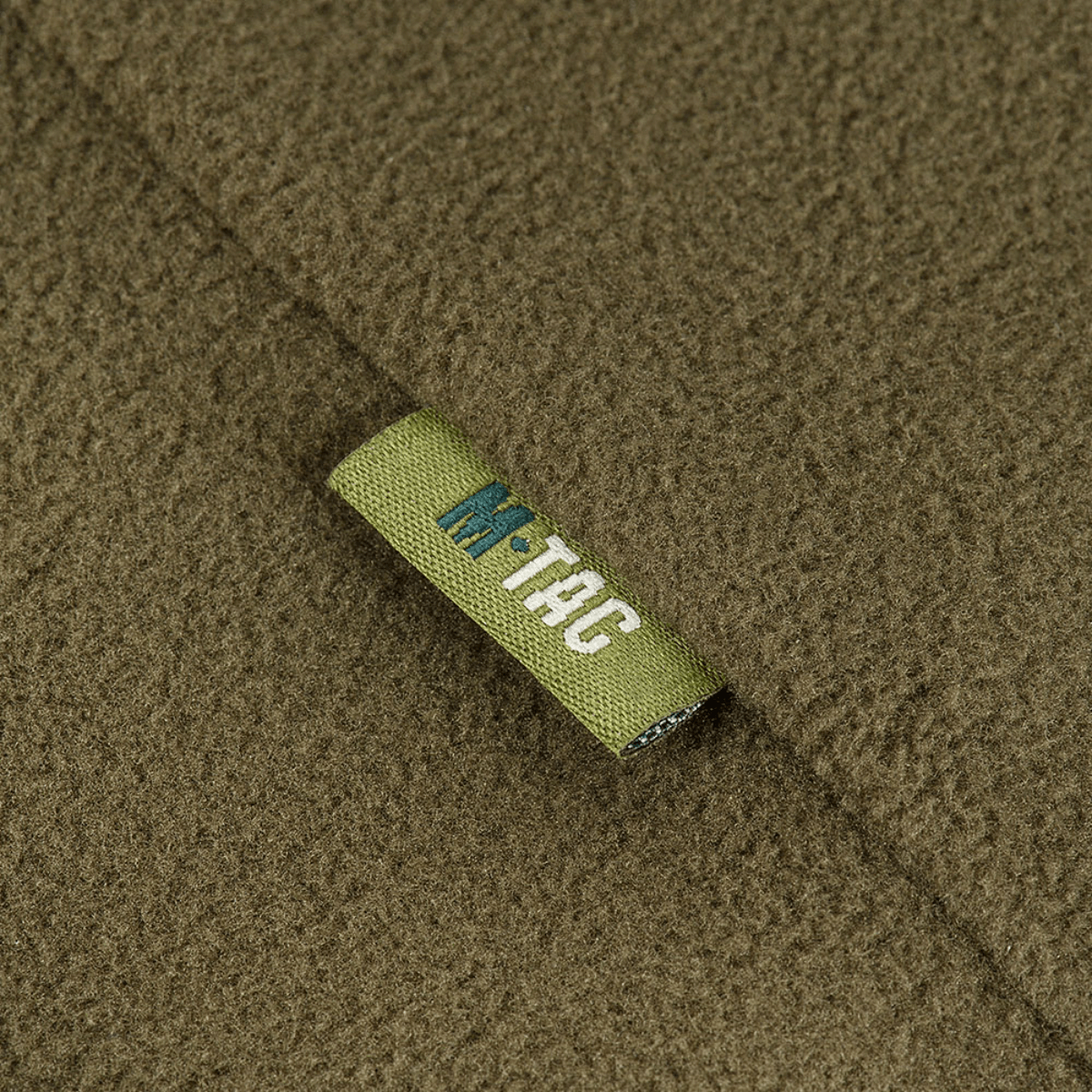 M-Tac Delta Polartec Fleecejakke detalje med blød Polartec® Micro Series-fleece, ideel til varmeisolering på kolde dage.