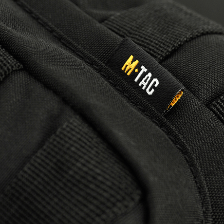 M-Tac Assistant Taske med justerbar enkeltsele og MOLLE-paneler i sort materiale 600D. Praktisk til daglig brug.