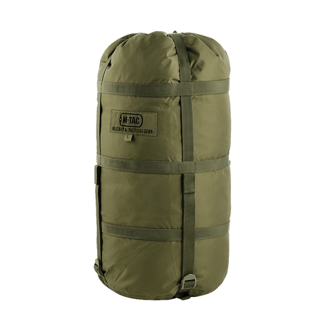 M-Tac Kompressionspose i vandafvisende nylon med stropper til pladsbesparelse, ideel til sikker opbevaring og transport af udstyr.