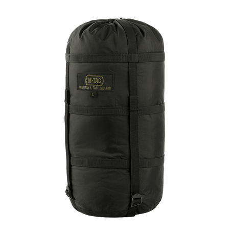 M-Tac Kompressionspose i sort nylon med kompressionsstropper, ideel til beskyttelse mod fugt og pladsbesparelse under transport.