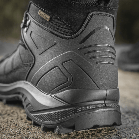 M-Tac Taktiske Sæsonstøvler i læder og Cordura®, velegnet til krævende terræn. Komfortable og slidstærke til trekking og outdoor-brug.