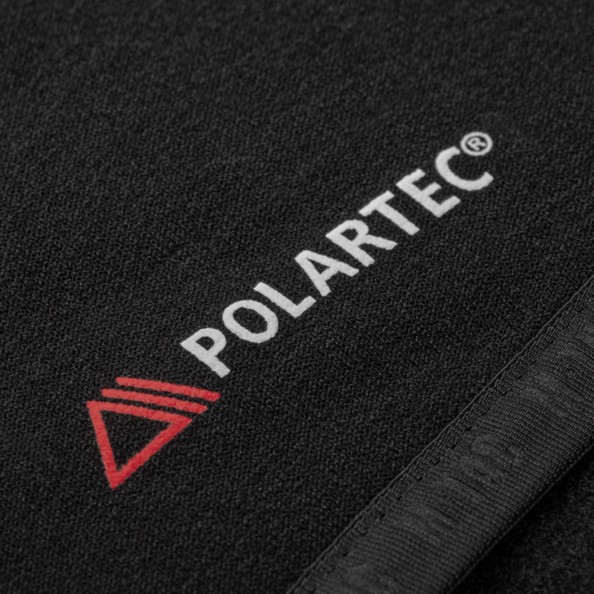 Polartec logo on the M-Tac Shadow Polartec Fleece Sweatshirt fabric in black, showcasing the high-quality material.