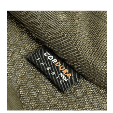 Nærbillede af M-Tac Bat Wing Taske Elite Hex med robust Cordura Hex stof i grøn farve med tekstur, fremhæver holdbarhed.