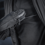 Person holding M-Tac Pocket Bag Elite HEX with durable YKK zipper in close-up view.