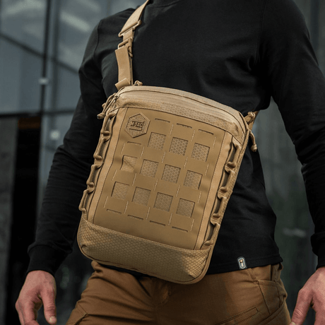 M-Tac Tablet Bag Laser Cut Hex in tan color worn crossbody, ideal for EDC, documents, and tablets with Laser Cut MOLLE design.