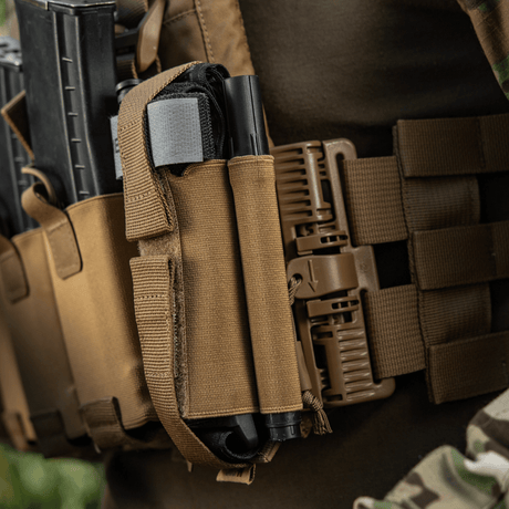 M‑Tac Tourniquet Pouch Elastic Gen.5 fastgjort til taktisk udstyr, ideel til CAT tourniquet, med elastik og velcro for hurtig adgang.