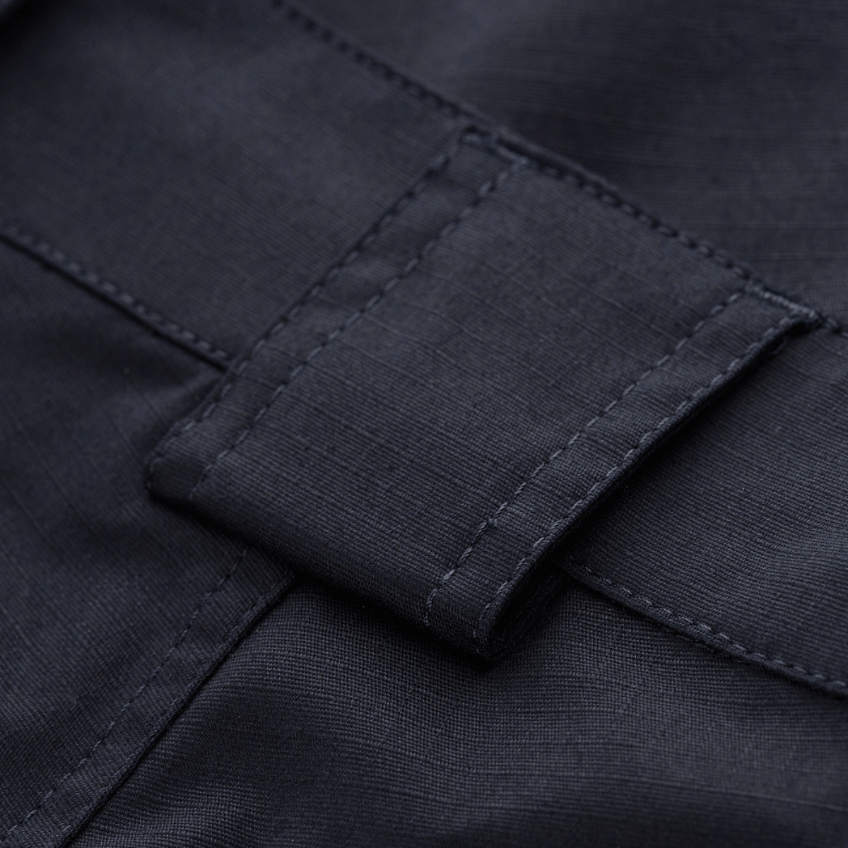 Nærbillede af M-Tac Shorts Aggressor Gen.II Flex med letvægts rip-stop materiale og Teflon-belægning, der er vand- og smudsafvisende.