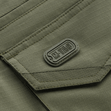 Detalje af M-Tac Shorts Aggressor Gen.II Flex med taktisk design i rip-stop materiale, grå farve.