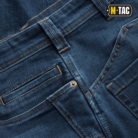 Detalje af M-Tac Tactical Gen.I Regular Fit jeans med kraftig syning og klassisk blå denim farve.