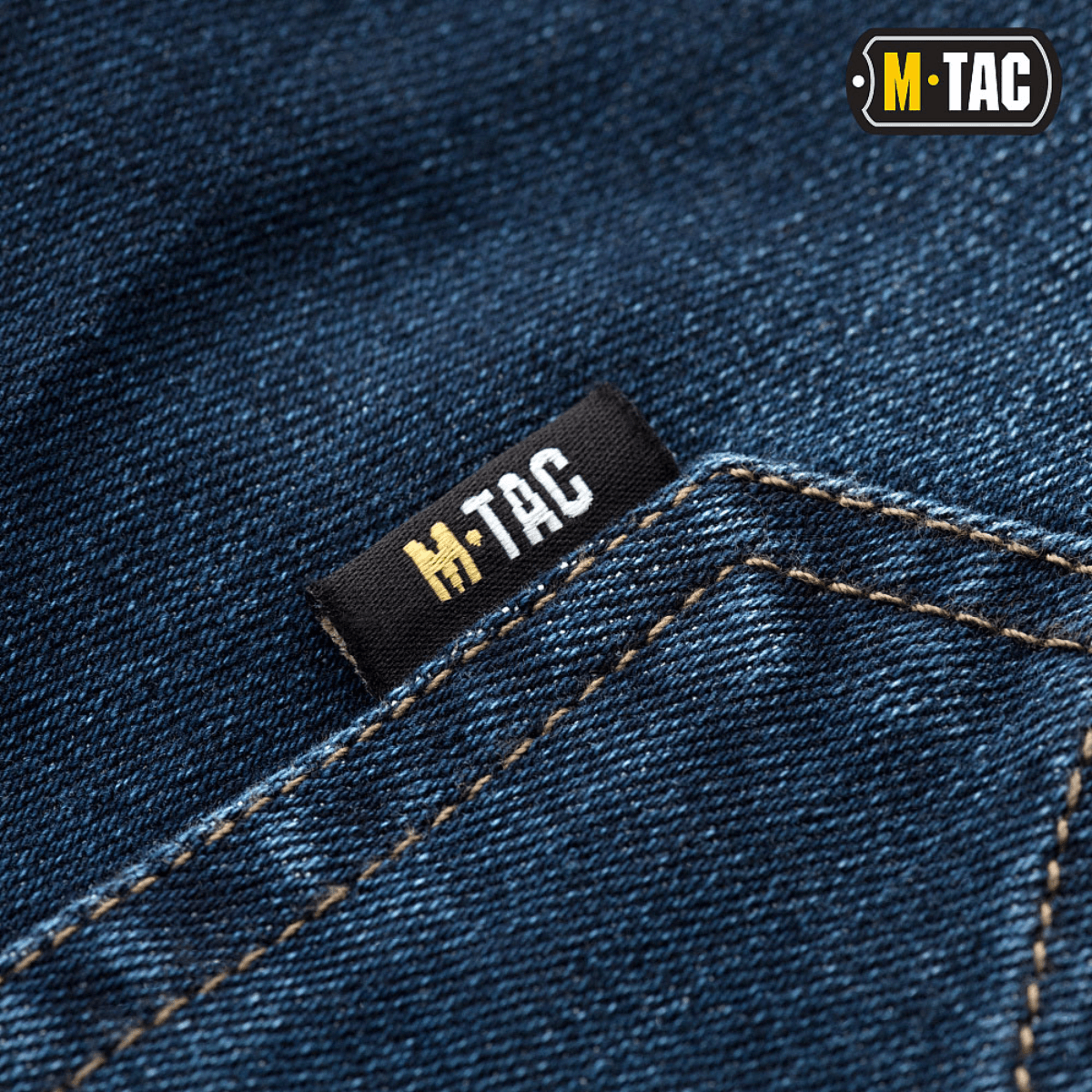 Close-up af M-Tac Tactical Gen.I Regular Fit jeans med M-Tac logo på baglommen.
