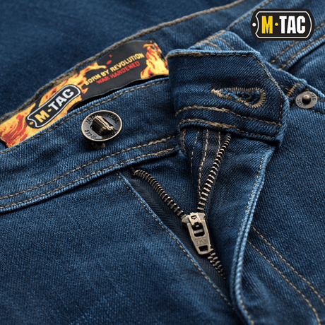 Nærbillede af M-Tac Tactical Gen.I Regular Fit jeans med lynlåsdetaljer og M-Tac logo.