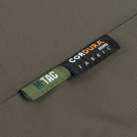 Detalje af M-Tac Alpha Gen.III Pro Vinterjakke med CORDURA stofmærke til holdbarhed og komfort.