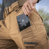 M-Tac Bukser Aggressor Vintage med iPhone i lommen, komfortabel pasform og bælteholder, ideelle til hverdagsbrug og feltarbejde.