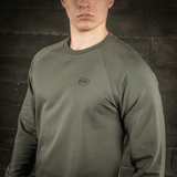 M-Tac Raglan Athlete sweatshirt i oliven, med rund hals og raglanærmer, ideel til sport og hverdag. 95% bomuld, 5% elastan for komfort.