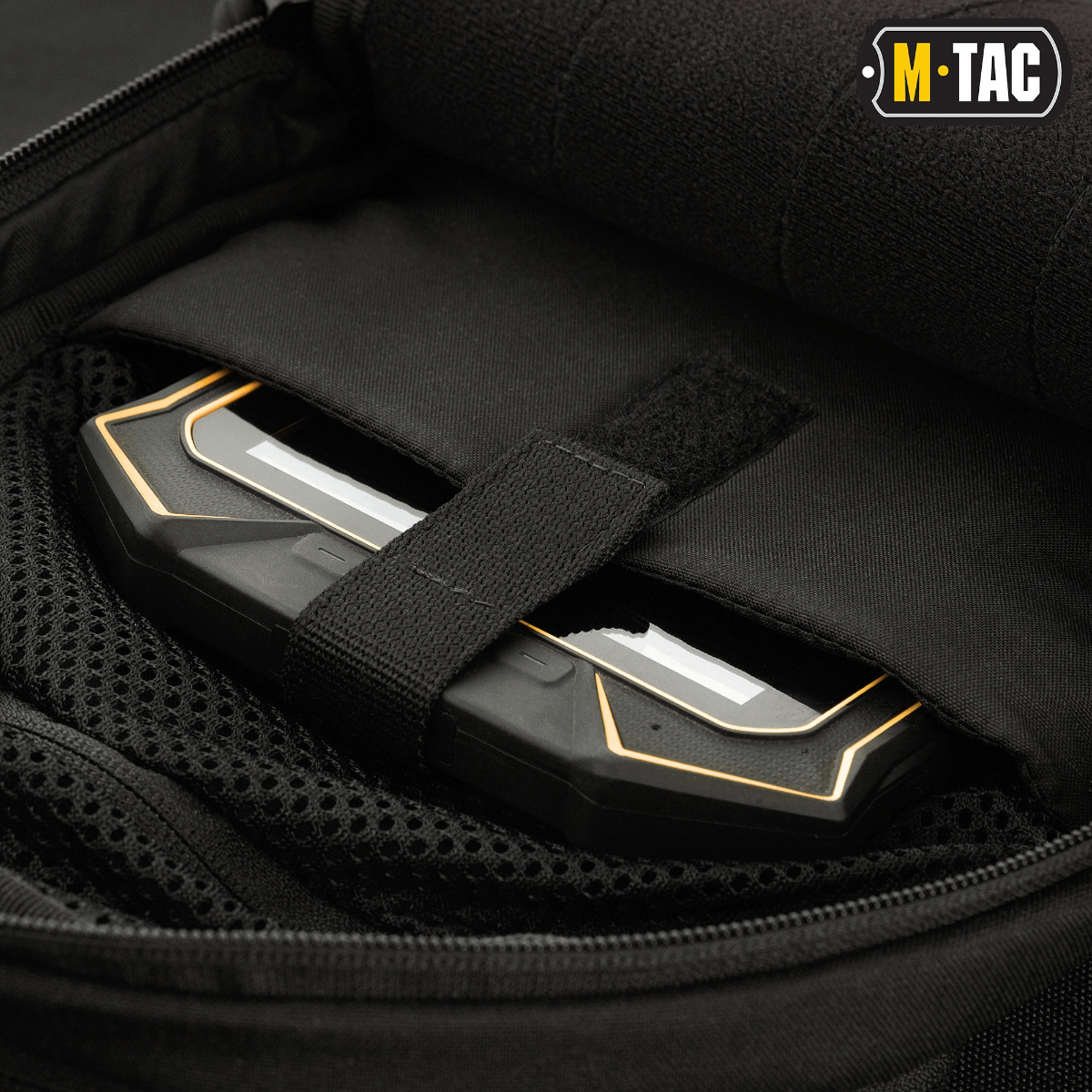 M-Tac Buckler Taske Elite med skjult våbenrum og MOLLE-system i sort Cordura 500D materiale.