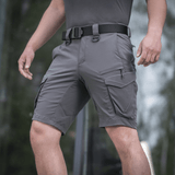 M-Tac Aggressor Summer Flex Shorts in use, showcasing tactical design with 7 functional pockets and durable Flex Rip-Stop fabric.