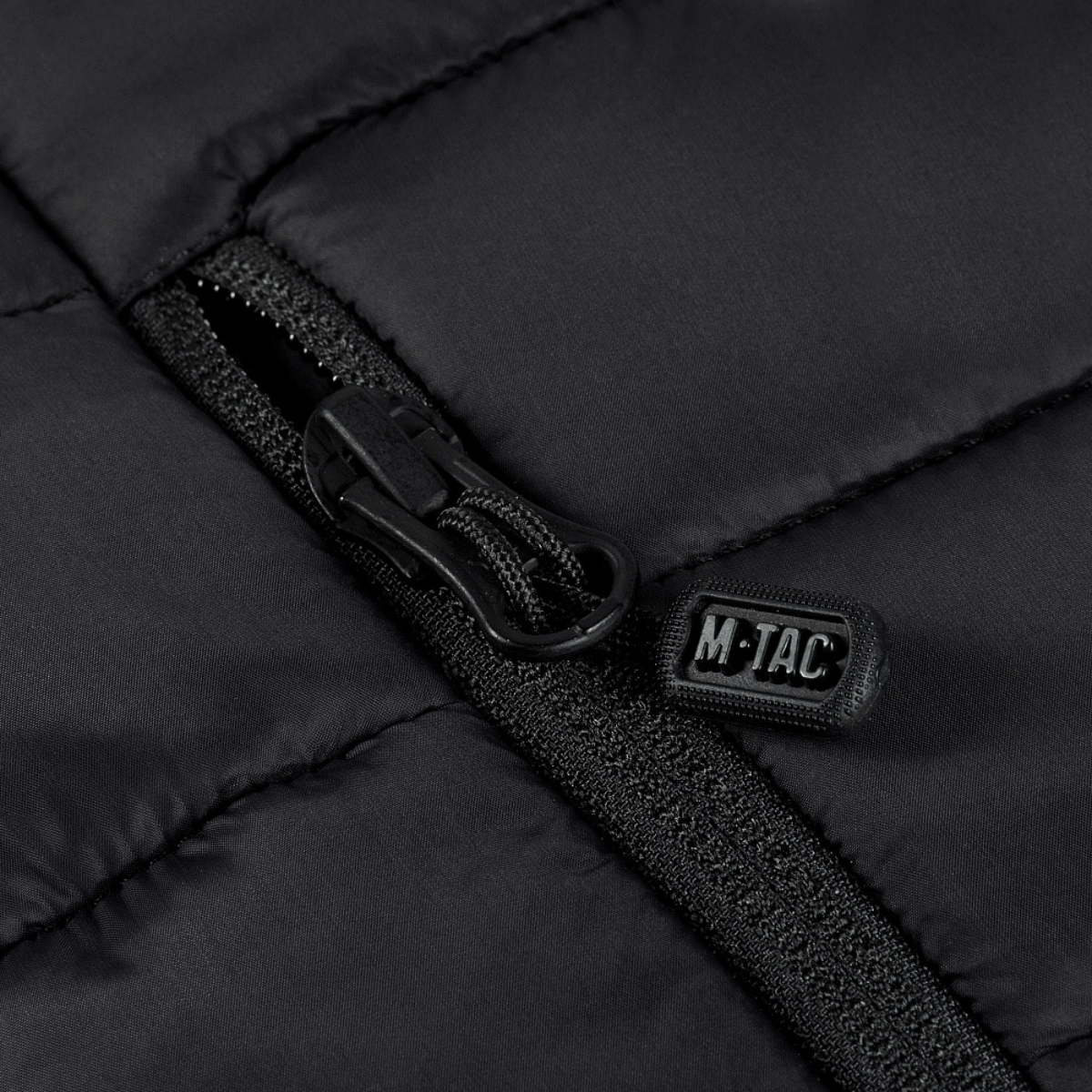 Detaljebillede af YKK lynlås på M-Tac Stalker Gen.III Jakke i stilfuldt og varmt design.