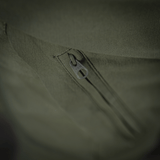 Nærbillede af lynlåsdetalje på M-Tac Bukser Aggressor Summer Flex Dame, viser kvalitets YKK-lukninger i grøn rip-stop nylonstof.