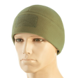 M-Tac Watch Cap Elite Fleece Beanie Hat Velcro i grøn, lavet af 100% polyester fleece, med velcro-panel til mærker. Ideel til koldt vejr.