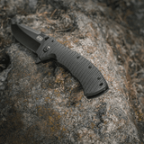 M-Tac Outdoor & Militær foldekniv - Type 7 på sten, letvægts design, sort klinge i krom rustfrit stål, frame-lock mekanisme