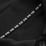 Nærbillede af M-Tac Tactical Polo Shirt 65/35 med M-Tac mærke, ideel til politi- og sikkerhedsarbejde i bomuld og polyester for komfort.