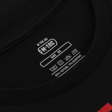 Nærbillede af M-Tac T-Shirt Freedom label, XS størrelse, 93% bomuld, 7% elastan. Viser vaskeanvisninger og mærkelogo.