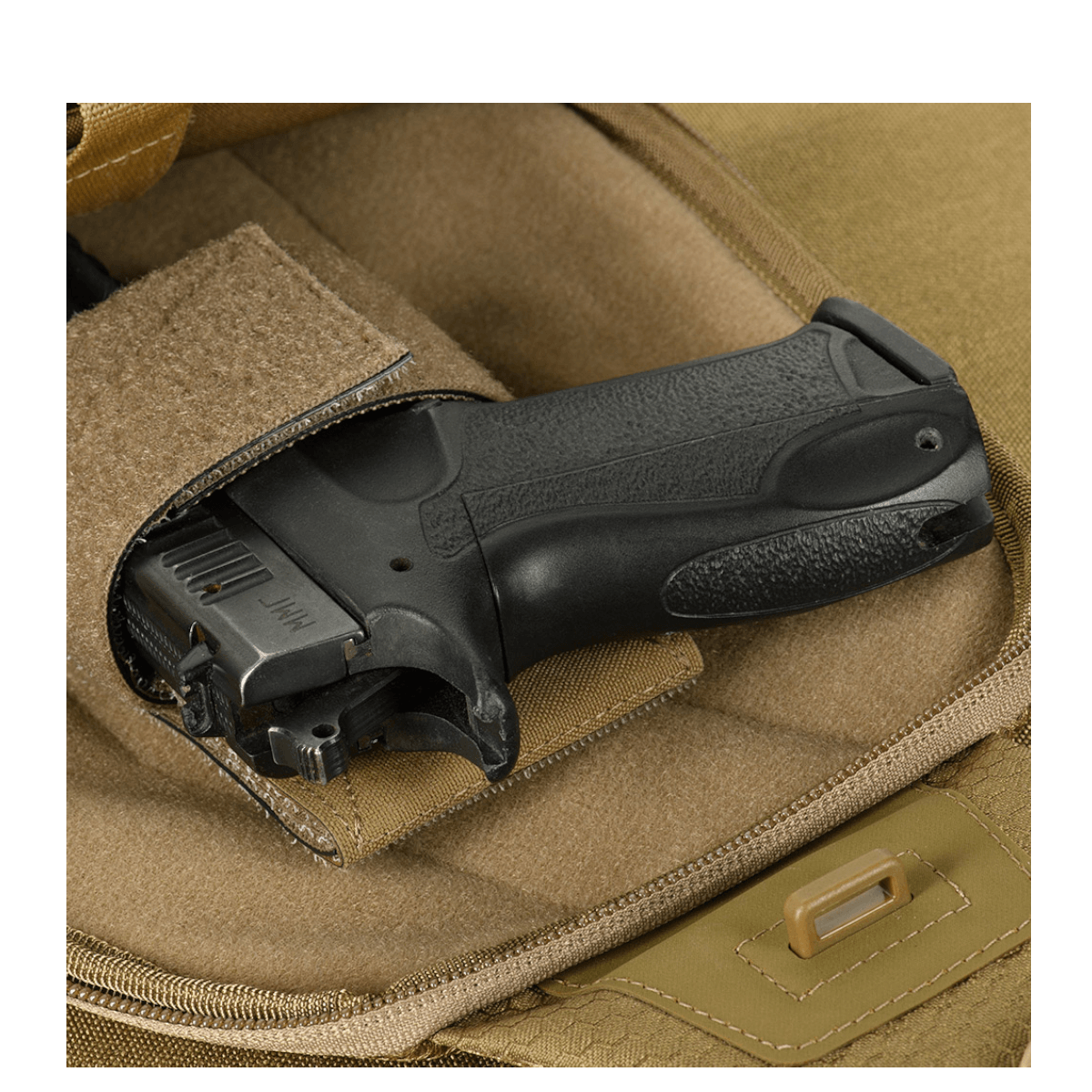 M-Tac Buckler Taske Elite Hex med skjult bærefunktion og MOLLE-system i Hex-Cordura materiale. Ideel til sikker opbevaring af våben.